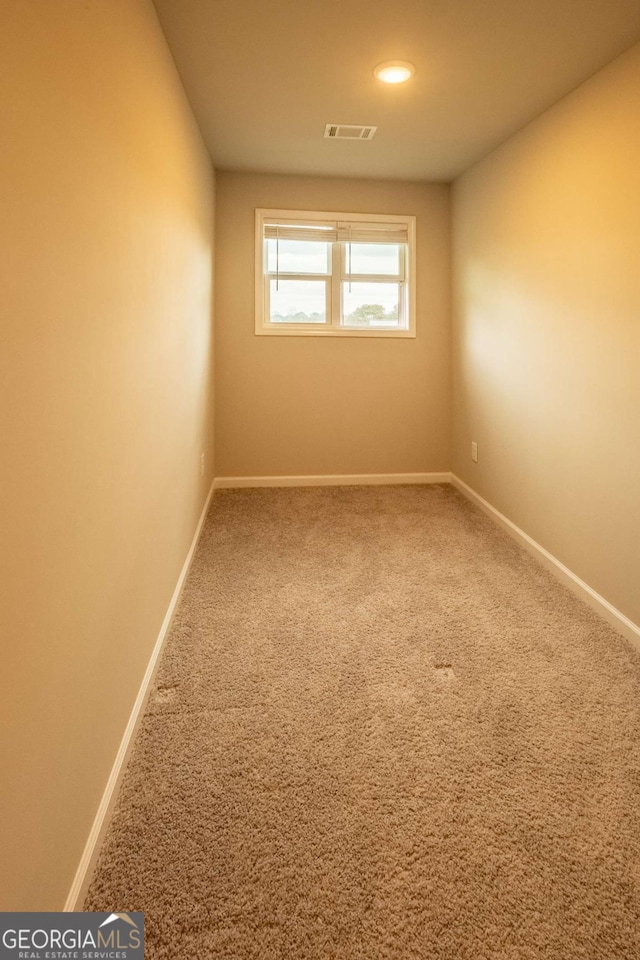 unfurnished room featuring carpet flooring