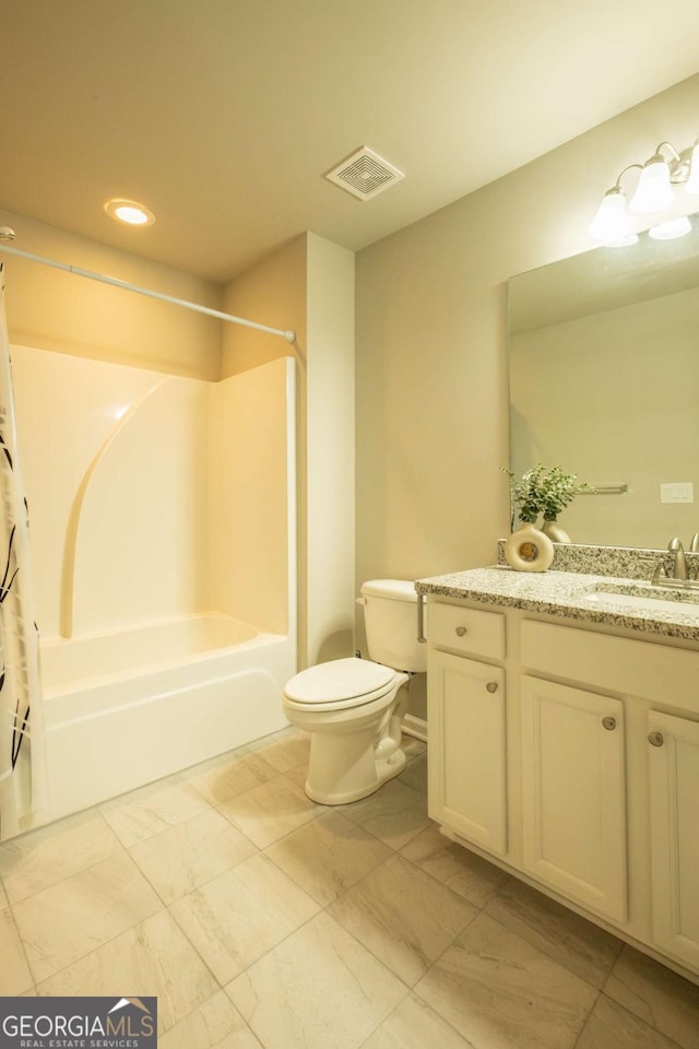 full bathroom featuring toilet, vanity, and shower / tub combo