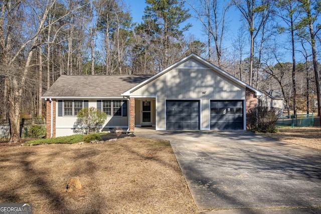 ranch-style house featuring a garage