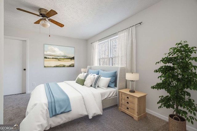 bedroom featuring ceiling fan, carpet flooring, and a textured ceiling