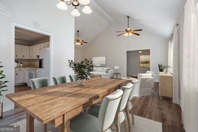 dining area with ceiling fan with notable chandelier, high vaulted ceiling, dark hardwood / wood-style floors, and beam ceiling