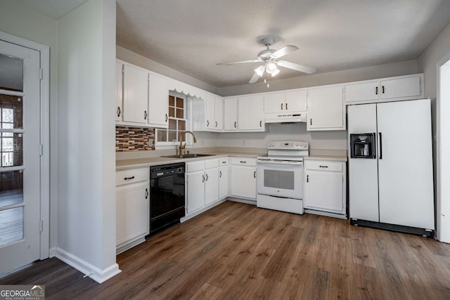 kitchen featuring plenty of natural light, sink, white appliances, white cabinets, and dark hardwood / wood-style floors