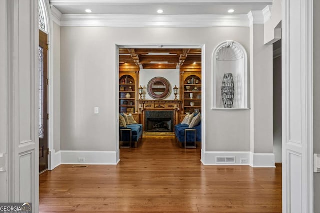 4080 Ryckeley Dr, Gainesville, GA 30504 - hallway with visible vents, crown molding, baseboards, built in features, and wood finished floors