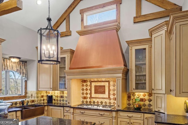 4080 Ryckeley Dr, Gainesville, GA 30504 - kitchen with decorative backsplash, a notable chandelier, stainless steel gas stovetop, and decorative light fixtures