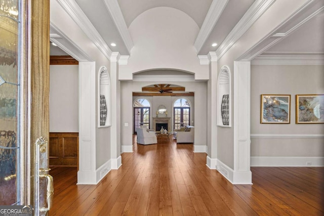 4080 Ryckeley Dr, Gainesville, GA 30504 - entryway with crown molding, baseboards, a fireplace, a ceiling fan, and wood-type flooring