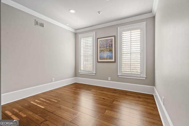 4080 Ryckeley Dr, Gainesville, GA 30504 - empty room featuring hardwood / wood-style flooring, baseboards, and ornamental molding