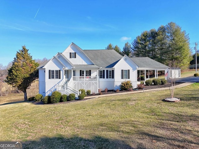 single story home with a front yard and a porch