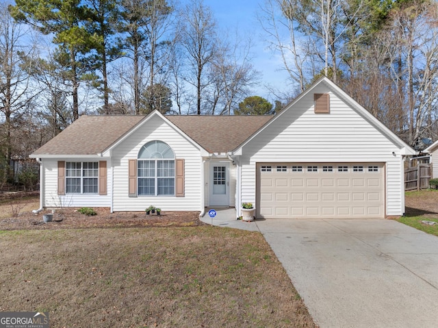 single story home featuring a front yard and a garage