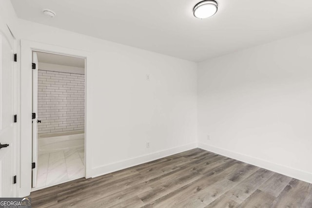 empty room featuring hardwood / wood-style flooring