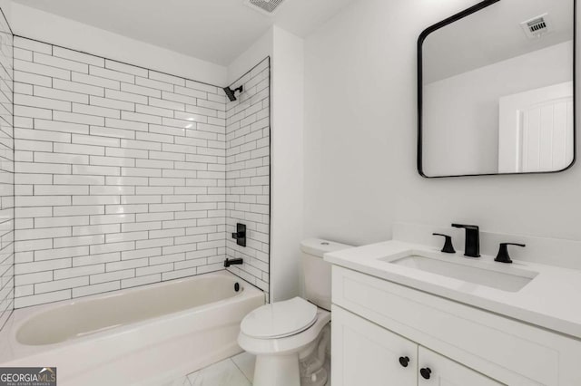 full bathroom featuring tiled shower / bath combo, toilet, and vanity