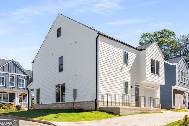 view of side of home featuring a garage