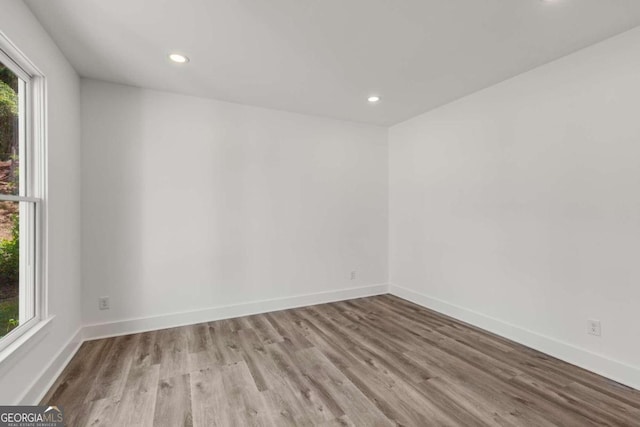 spare room with light hardwood / wood-style floors