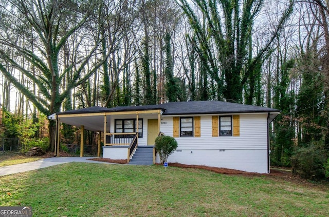 view of front facade with a carport, a front lawn, and a porch