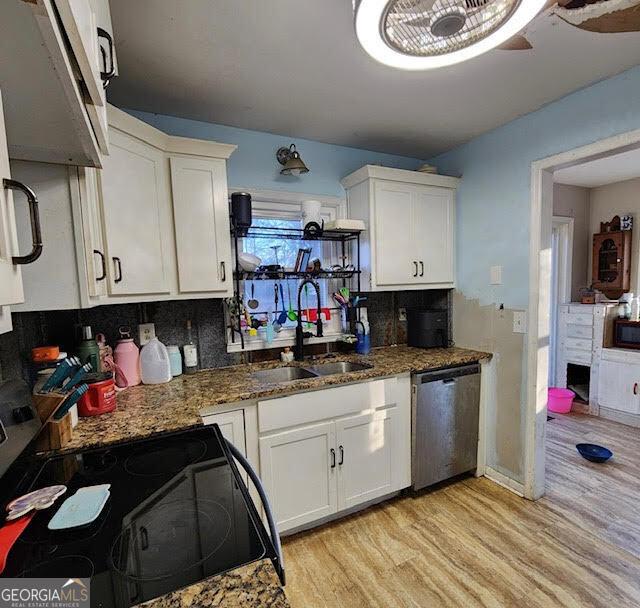 249 Ponderosa Ln, Barnesville, GA 30204 - kitchen with white cabinets, appliances with stainless steel finishes, sink, and dark stone counters