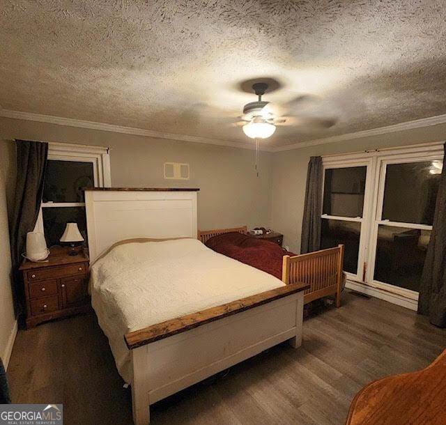 249 Ponderosa Ln, Barnesville, GA 30204 - bedroom featuring crown molding, dark hardwood / wood-style flooring, a textured ceiling, and ceiling fan