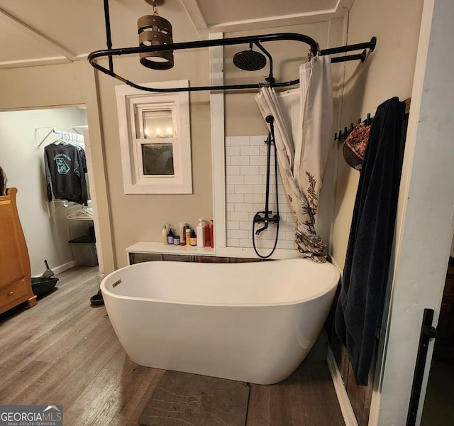 249 Ponderosa Ln, Barnesville, GA 30204 - bathroom featuring hardwood / wood-style flooring and shower with separate bathtub