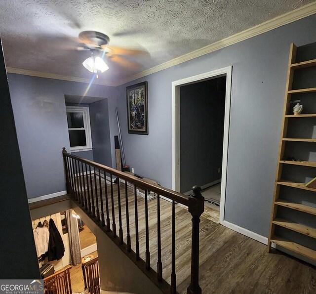 249 Ponderosa Ln, Barnesville, GA 30204 - hallway with a textured ceiling, crown molding, and dark hardwood / wood-style flooring