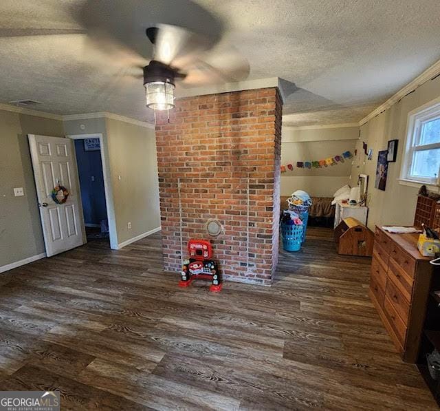 249 Ponderosa Ln, Barnesville, GA 30204 - interior space with a textured ceiling, crown molding, and dark hardwood / wood-style floors
