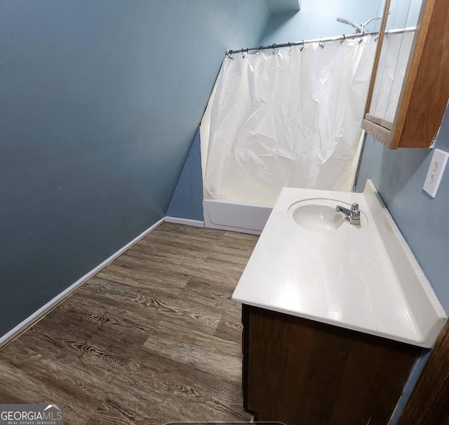 249 Ponderosa Ln, Barnesville, GA 30204 - bathroom featuring shower / bath combo with shower curtain, vanity, and hardwood / wood-style floors