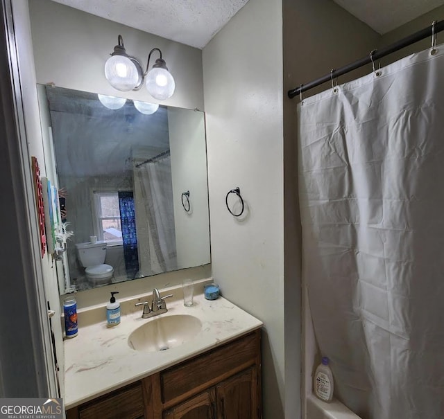 249 Ponderosa Ln, Barnesville, GA 30204 - bathroom with a textured ceiling and vanity