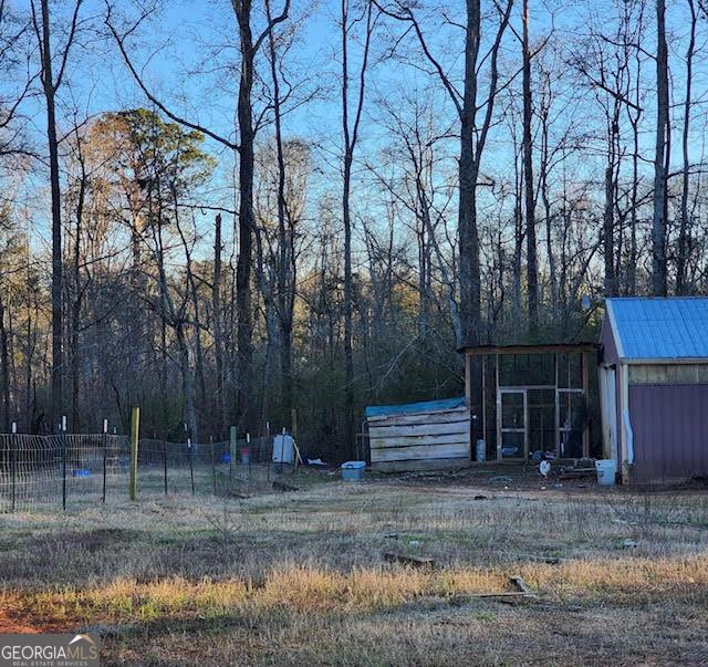 249 Ponderosa Ln, Barnesville, GA 30204 - view of yard featuring an outbuilding