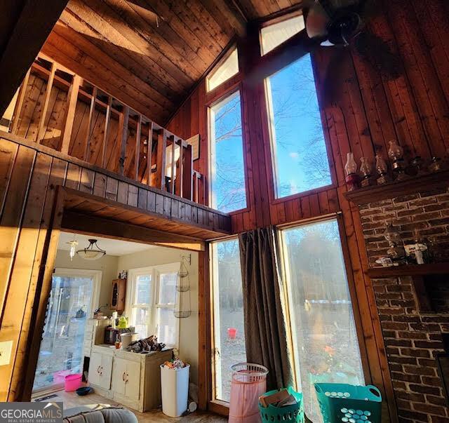 249 Ponderosa Ln, Barnesville, GA 30204 - room details with wood walls, beamed ceiling, and wood ceiling