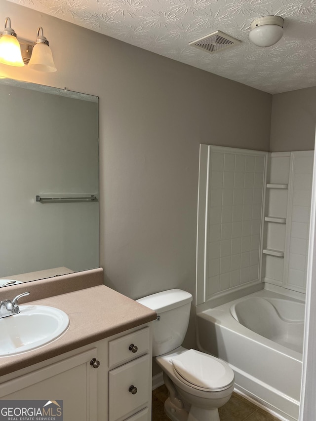 full bathroom featuring vanity, a textured ceiling, tile patterned flooring, toilet, and bathtub / shower combination