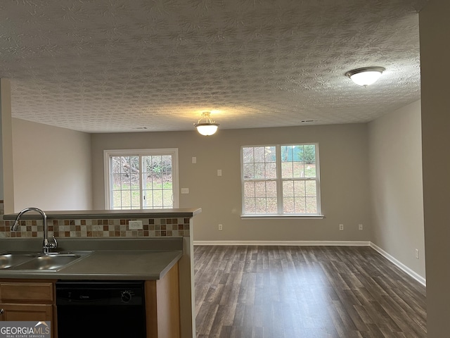 kitchen with dishwasher, backsplash, dark hardwood / wood-style floors, and sink