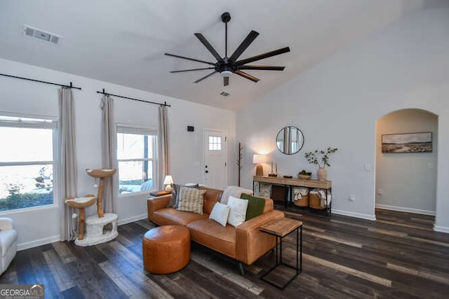 living room with high vaulted ceiling, ceiling fan, and dark hardwood / wood-style floors