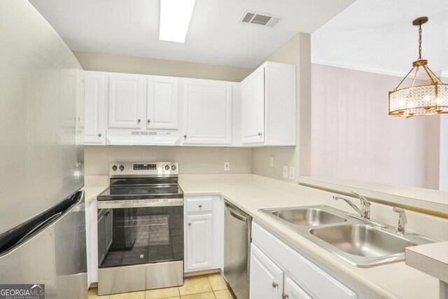 1101 Juniper St NE Unit 722, Atlanta, GA 30309 - kitchen featuring stainless steel appliances, under cabinet range hood, white cabinets, and light countertops