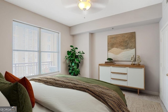 1101 Juniper St NE Unit 722, Atlanta, GA 30309 - bedroom featuring multiple windows, light carpet, and ceiling fan