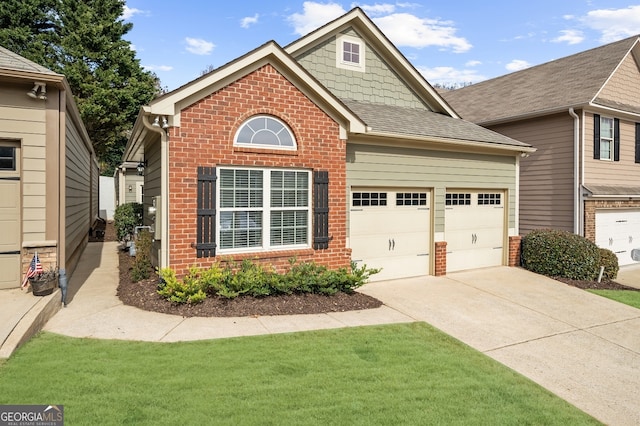 view of front facade with a front lawn and a garage