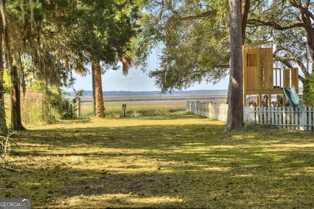 view of yard featuring a rural view and a playground