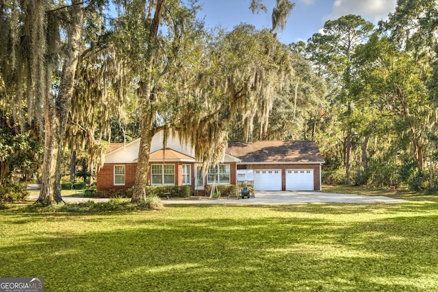 view of front facade with a front lawn and a garage