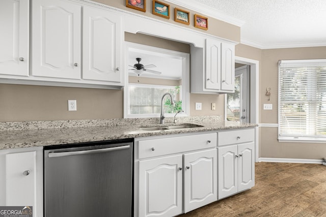 kitchen with white cabinetry, sink, ornamental molding, dishwasher, and a textured ceiling