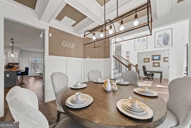 dining room featuring beam ceiling, dark hardwood / wood-style floors, and coffered ceiling