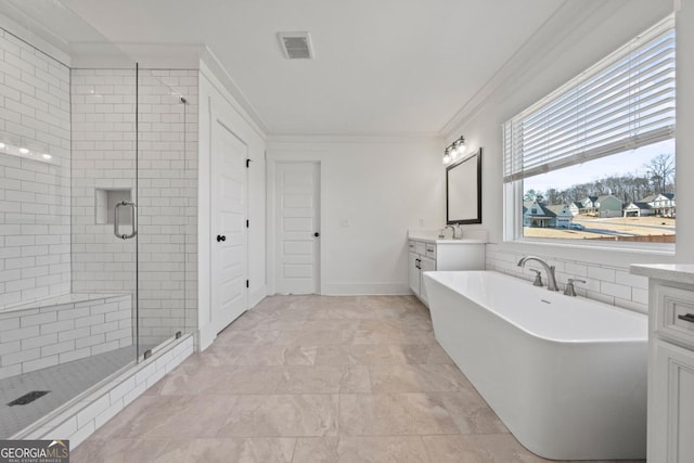 bathroom with crown molding, independent shower and bath, and vanity