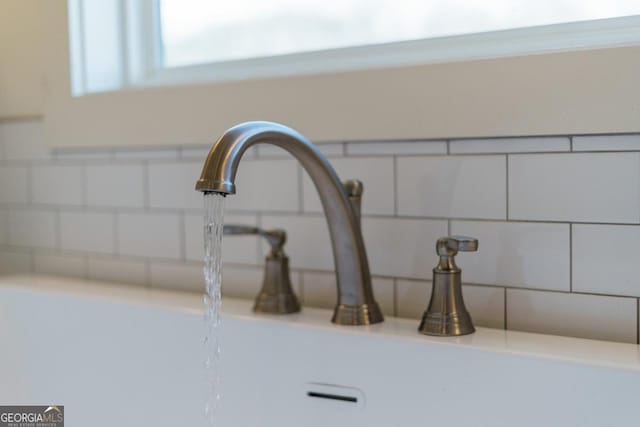 interior details with decorative backsplash and sink