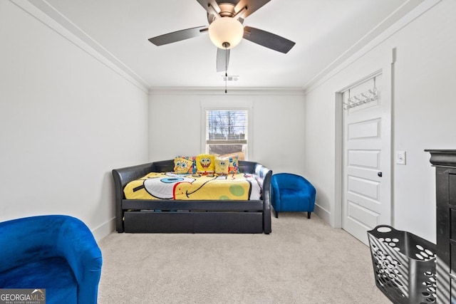 bedroom with carpet, ceiling fan, and ornamental molding