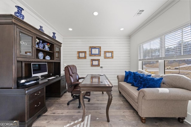 office featuring light wood-type flooring and ornamental molding