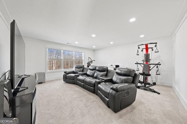 carpeted cinema room with crown molding