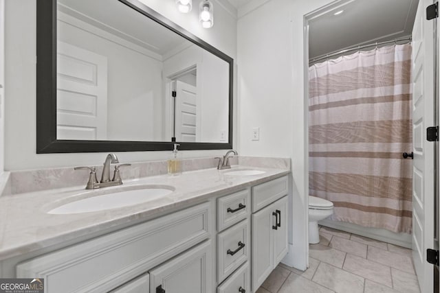 bathroom with tile patterned floors, toilet, and vanity