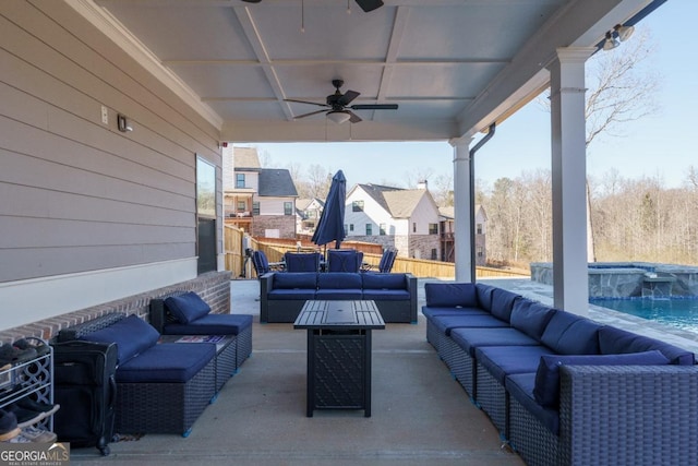 view of patio / terrace featuring ceiling fan, an outdoor hangout area, and a fenced in pool