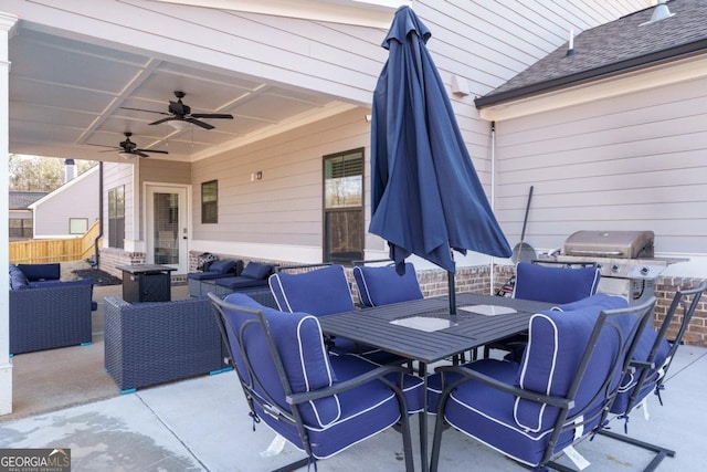 view of patio with an outdoor living space, area for grilling, and ceiling fan