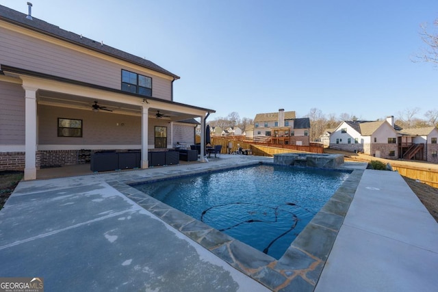 view of swimming pool with a patio, an in ground hot tub, an outdoor hangout area, and ceiling fan