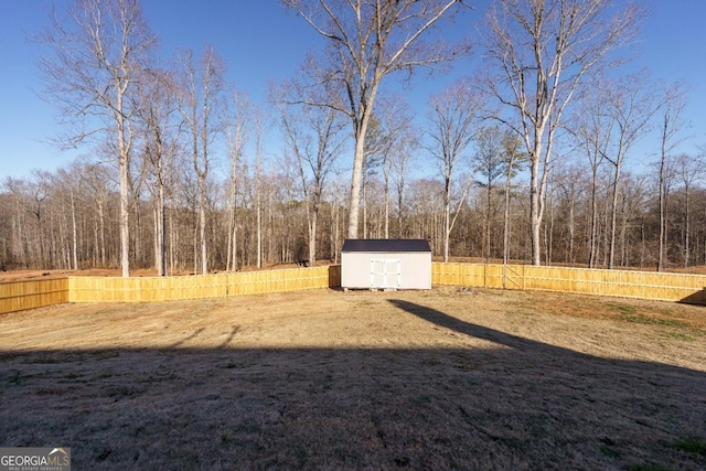 view of home's community with a shed and a yard