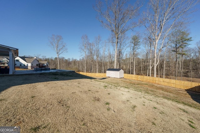 view of yard with a storage shed