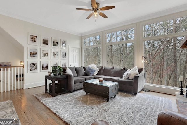 sunroom featuring plenty of natural light and ceiling fan