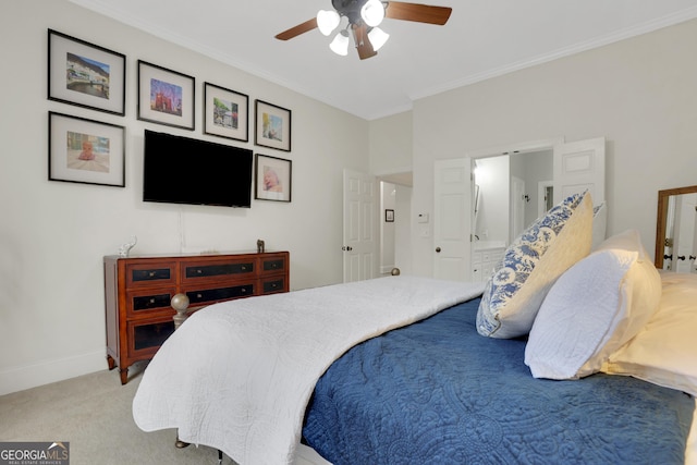 bedroom with ornamental molding, light colored carpet, ceiling fan, and ensuite bath