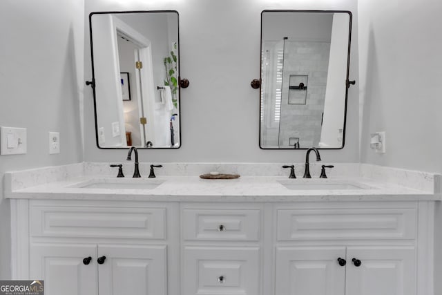 bathroom with vanity and a shower